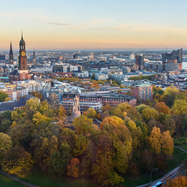 View of Hamburg with Michel, harbor, and New Elbphilharmony on sunset. Germany