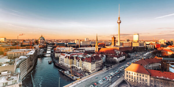 berlin cityscape with television tower under at sunset hour