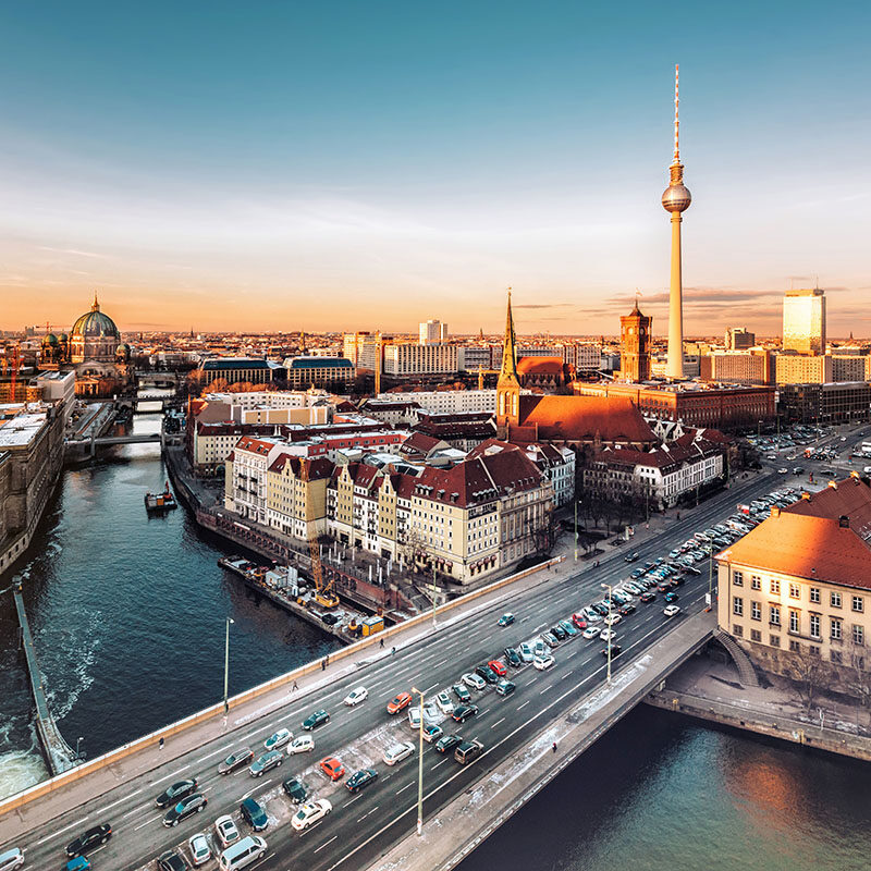 berlin cityscape with television tower under at sunset hour