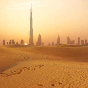 Dubai city skyline at sunset seen from the desert