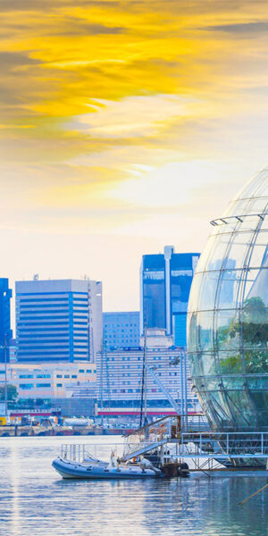 View of the port of Genoa dominated by an aquarium and the biosphere greenhouse design at sunset