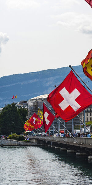 Mont Blanc Bridge and Swiss flags with ferris wheel Geneva in Switzerland