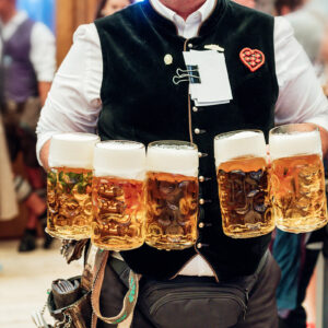 waiter carrying beer glasses at Octoberfest in Munich